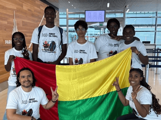 Team Guinea-Bissau poses with their country flag.
